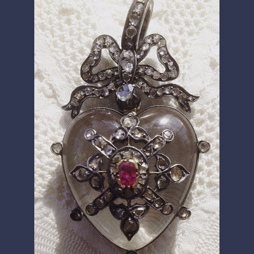 Victorian European mine cut diamonds , ruby ,silver and quartz crystal heart locket